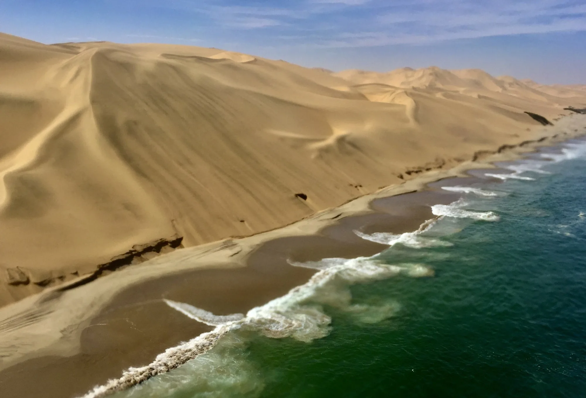 Namib dunes meeting the Atlantic Ocean, seen from above